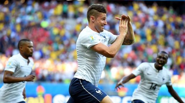 France's Giroud celebrates scoring the opener and his country's 100th World Cup goal. - Switzerland 0-3 France