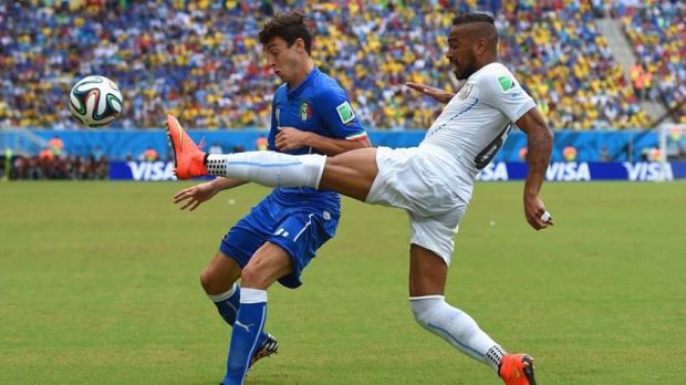 2014 FIFA World Cup - Uruguay's Alvaro Pereira vies for the ball with Italy's Matteo Darmian.