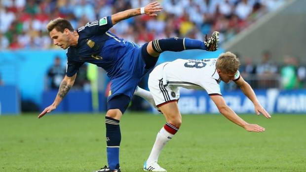 2014 FIFA World Cup - Argentina midfielder Lucas Biglia and Germany midfielder Toni Kroos vie for the ball at the Maracana.
